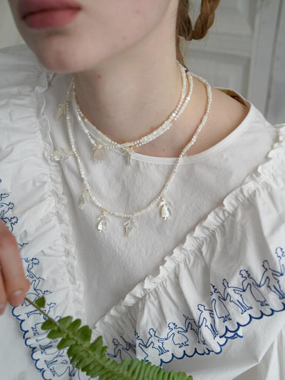 Unlogical Poem Vintage Style Small Person Silhouette Natural Shell Necklace